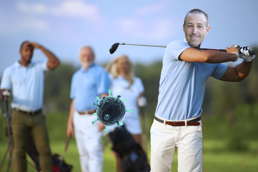 Male golfer following shot